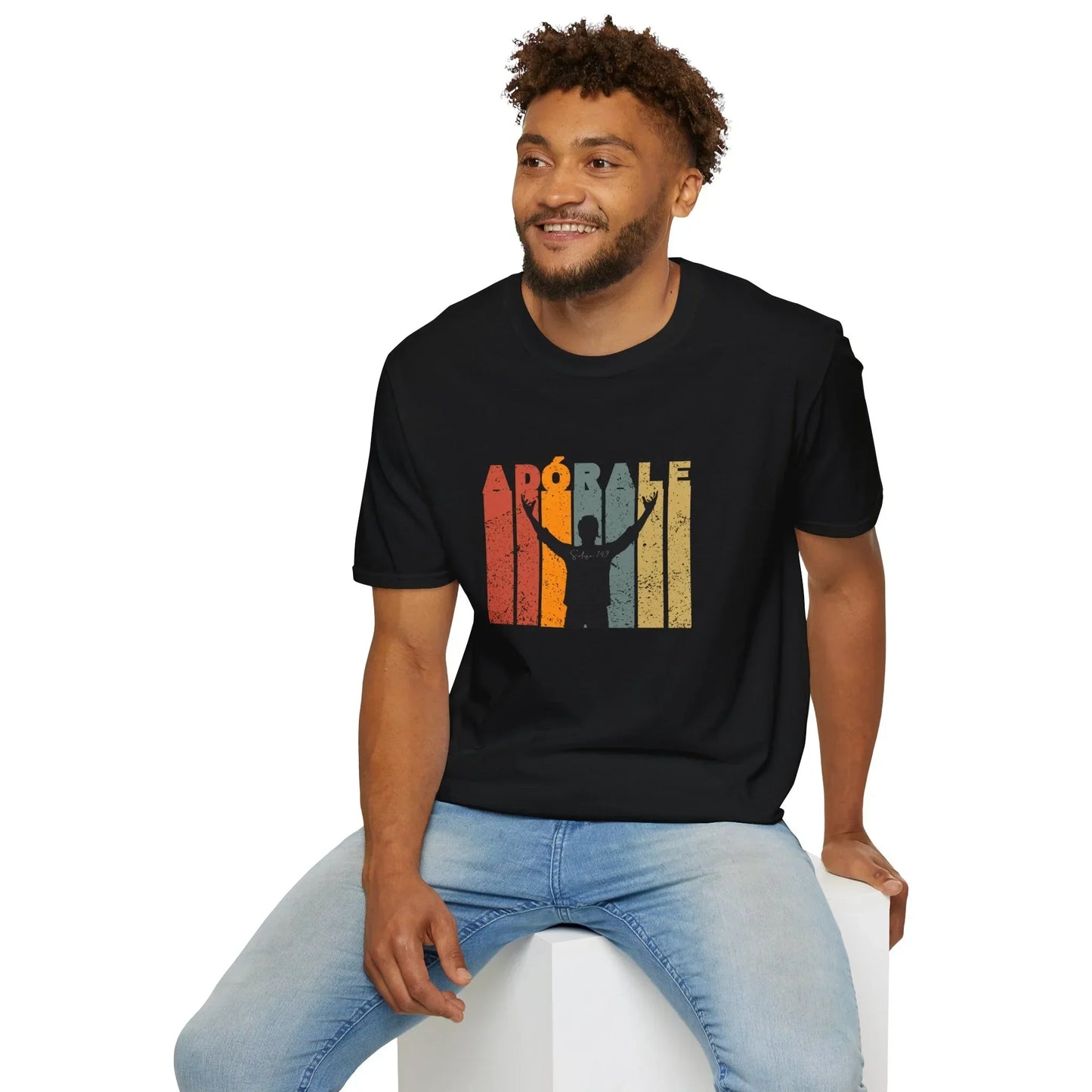 Man in black Christian graphic tee with 'Adórale' and worship silhouette, casual jeans