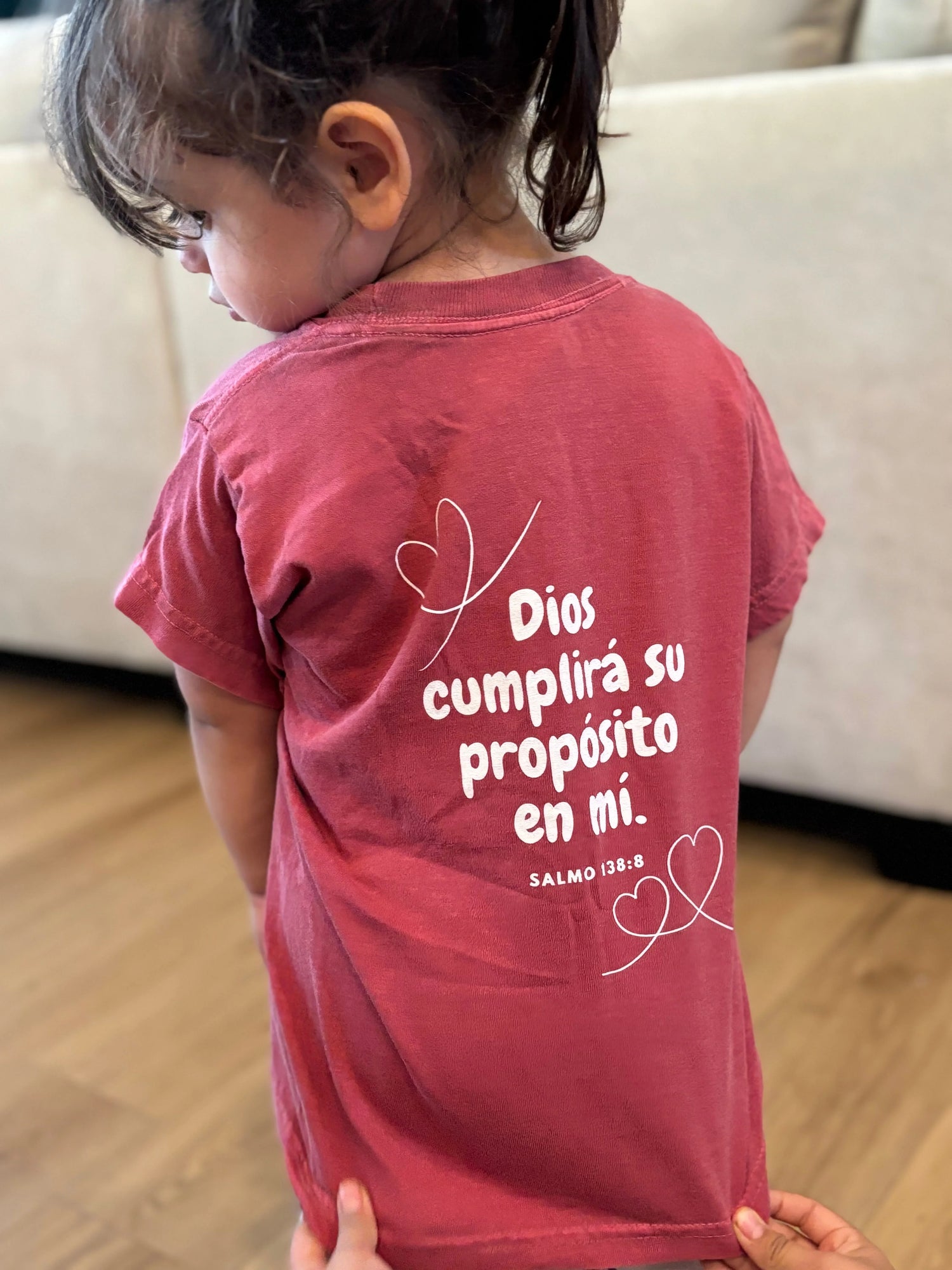 Little girl in red Christian T-shirt with Spanish Scripture and hearts, faith apparel