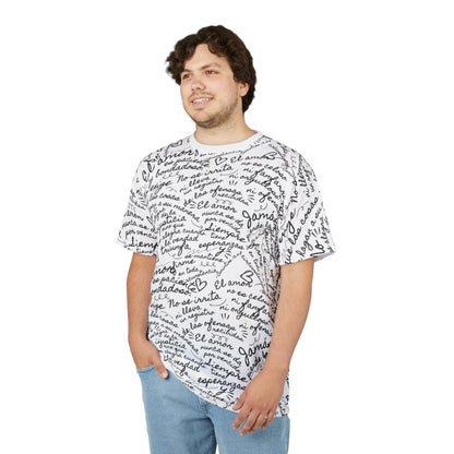 Man wearing a white Christian graphic tee with Spanish Bible verses and black handwritten script