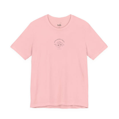 Pink Christian t-shirt with 'Kingdom First' text and floral line art design.