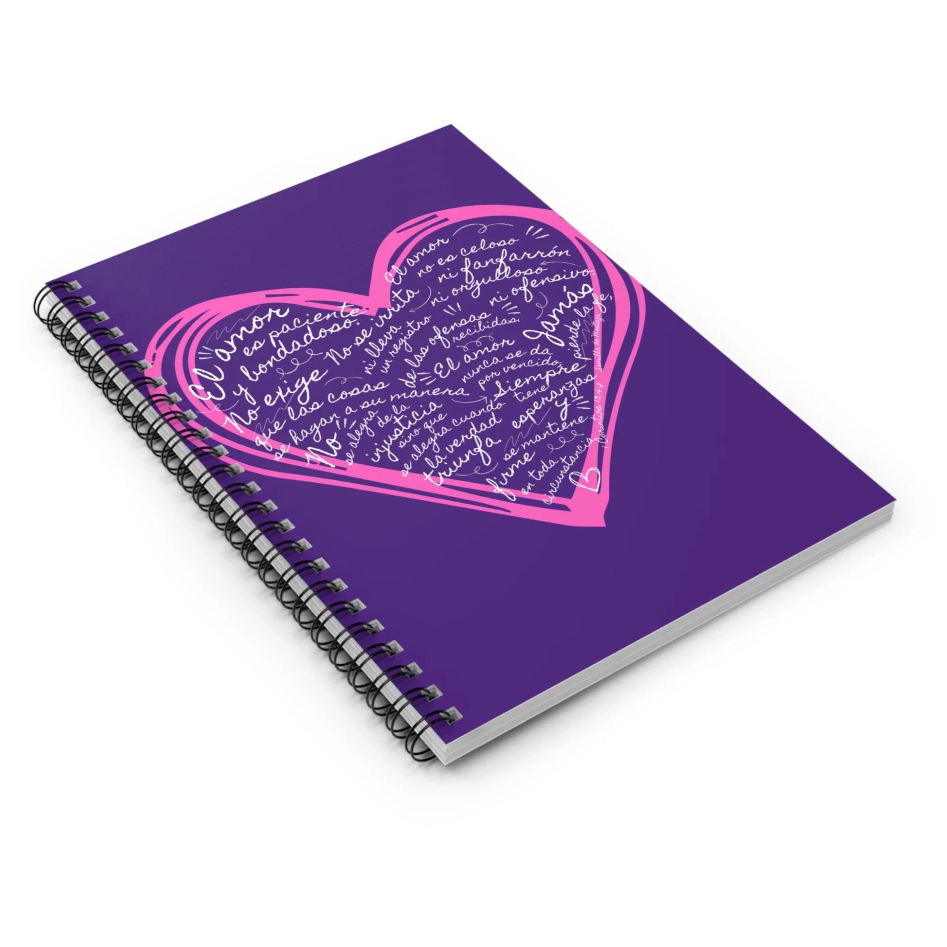 Purple spiral notebook with pink heart and Spanish Christian scriptural text on cover