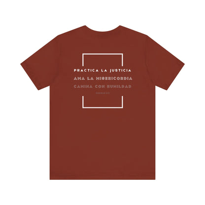 Rust red Christian t-shirt with Spanish Micah 6:8 Bible verse and geometric design