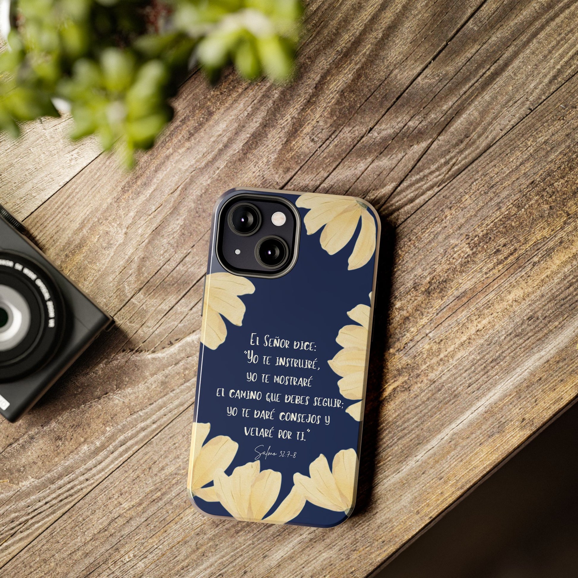 Christian phone case with Spanish Scripture and floral design on wood table