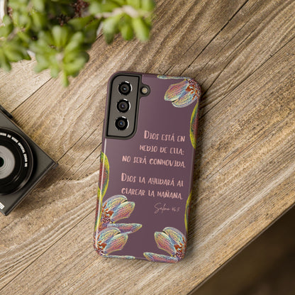 Christian phone case with Spanish Bible verse, floral design, on rustic wooden table