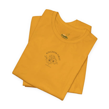 Yellow Christian t-shirt with 'Kingdom First' text, floral graphic, and Matthew 6:33 verse