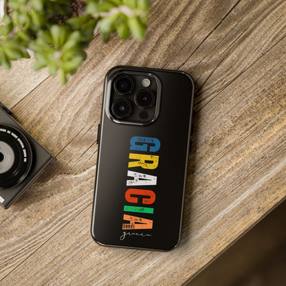 Christian phone case with colorful 'Gracia sobre Gracia' Scripture design on wood table