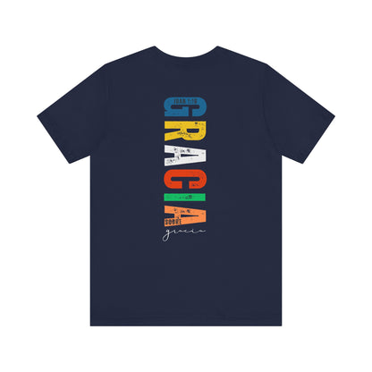 Navy Christian t-shirt with colorful vertical 'Gracia sobre gracia' and Juan 1:16 Scripture text.