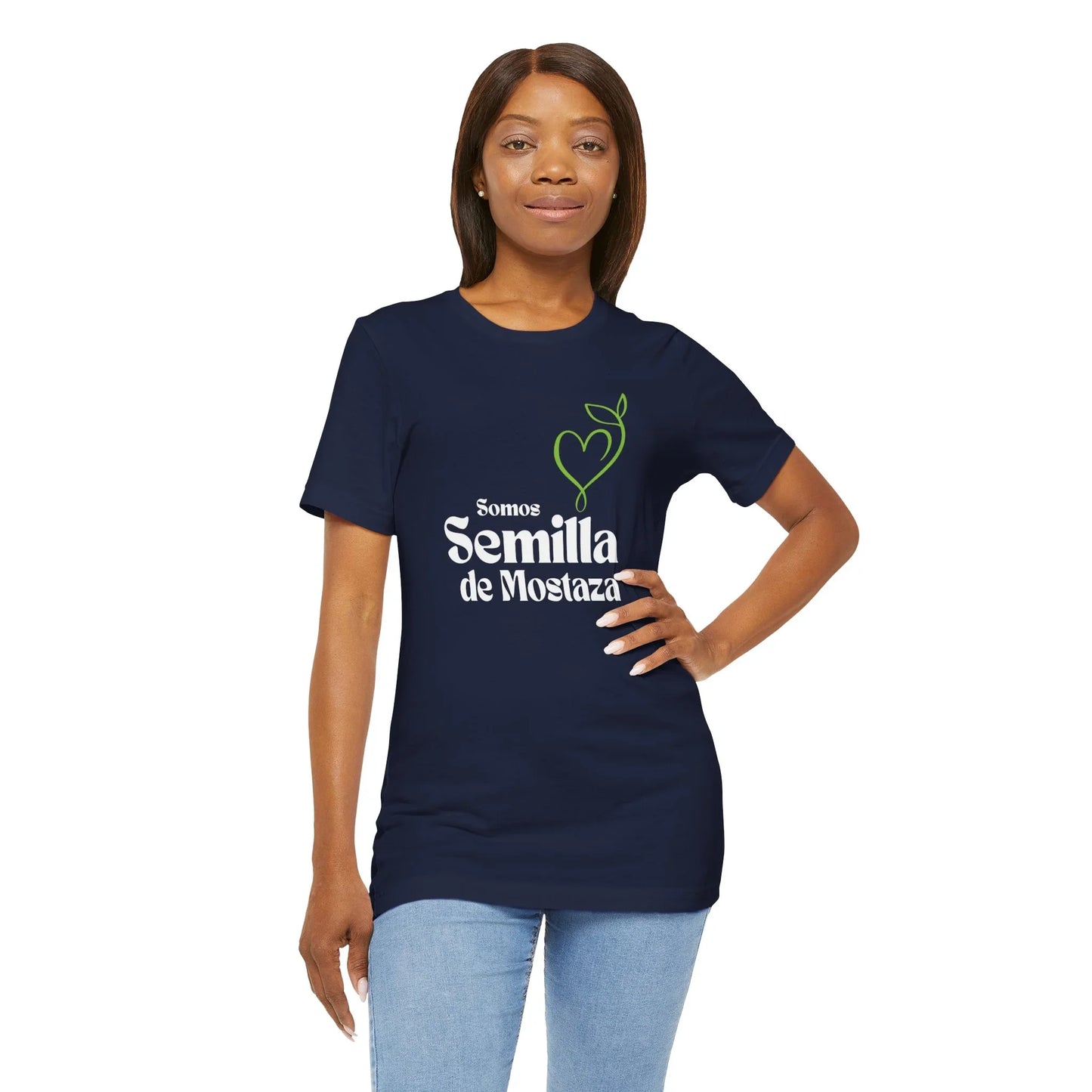 Woman wearing navy Christian t-shirt with 'Somos Semilla de Mostaza' text and heart plant graphic
