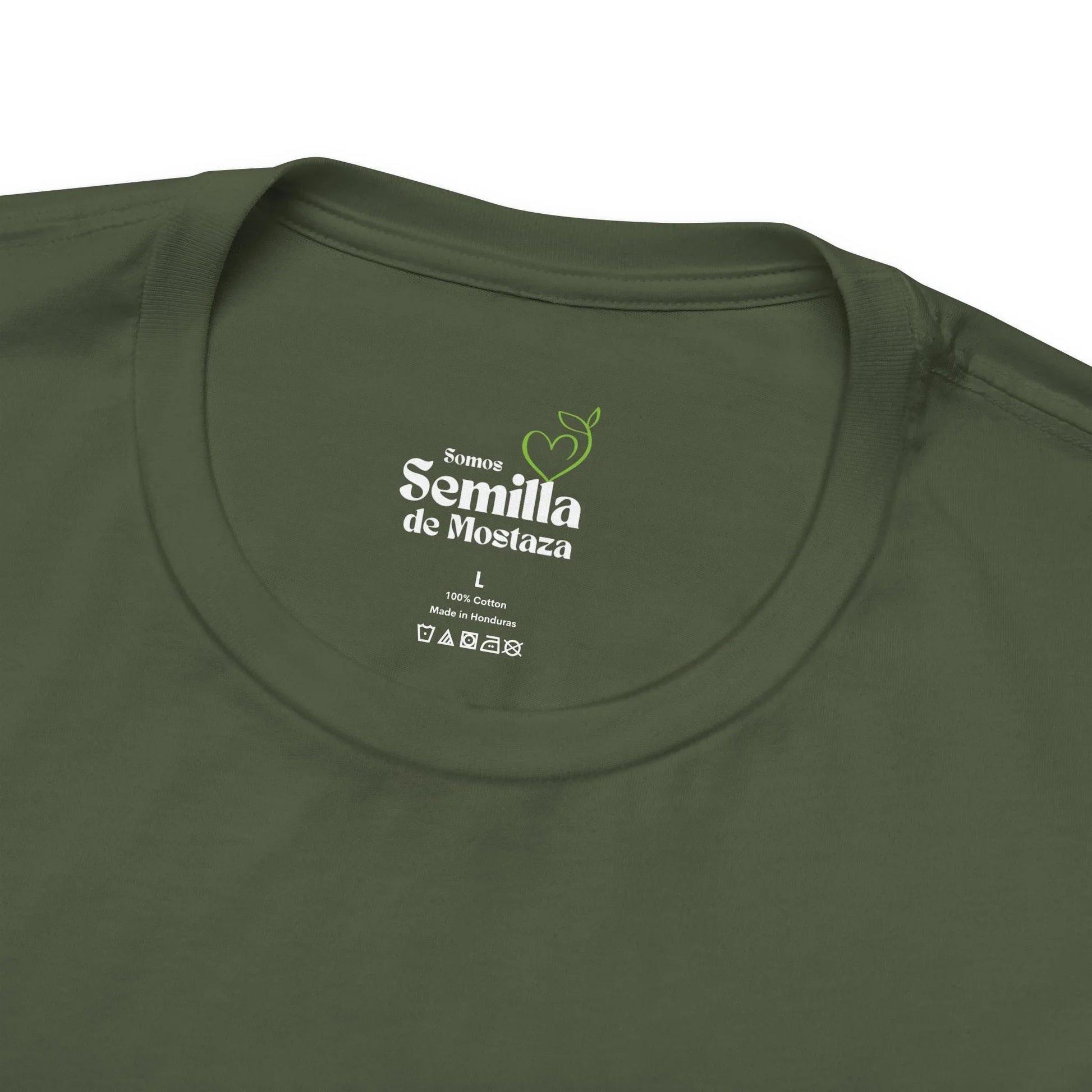 Olive green Christian t-shirt with 'Somos Semilla de Mostaza' label and care symbols.