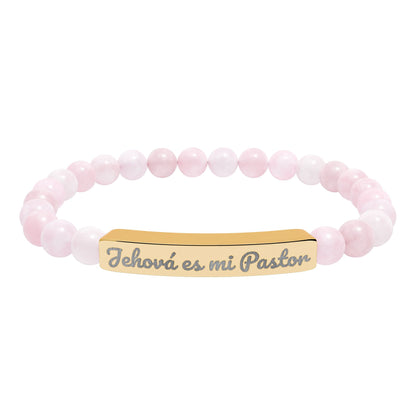 Pink beaded Christian bracelet with gold plate engraved 'Jehová es mi Pastor'
