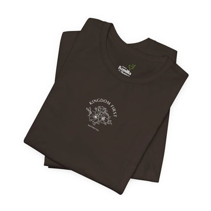 Black Christian t-shirt with 'Kingdom First' text, floral graphic, and Matthew 6:33 scripture.