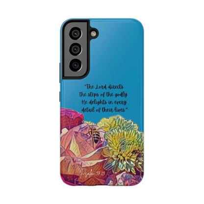 Christian phone case with Psalm 37:23 verse and colorful floral design on blue background