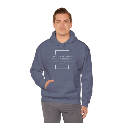 Man wearing blue Christian hoodie with Spanish faith quote and minimalist design