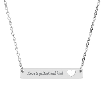 Silver Christian bar necklace engraved with 'Love is patient and kind' and heart cutout