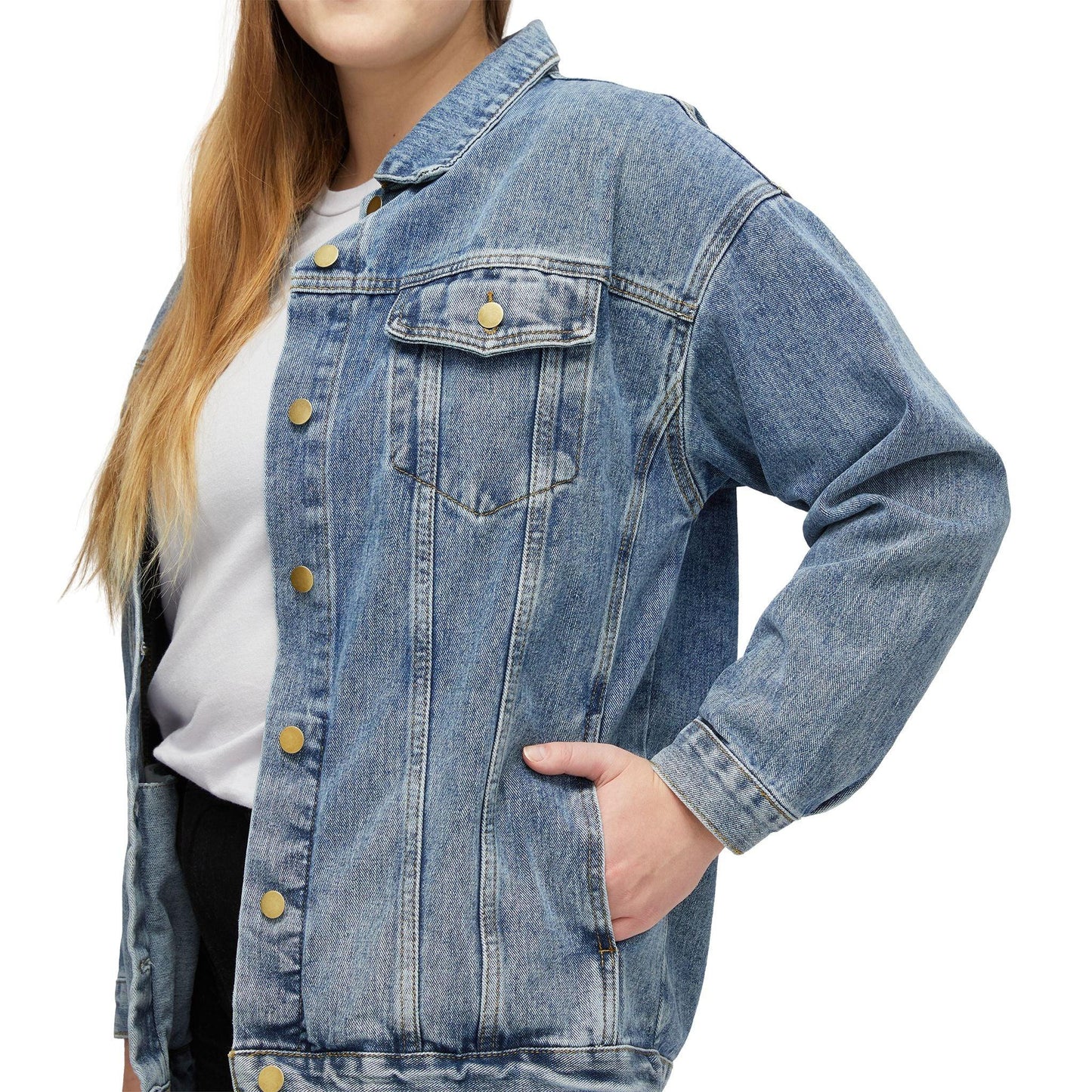 Woman wearing a classic blue denim jacket over a white shirt, hand in pocket