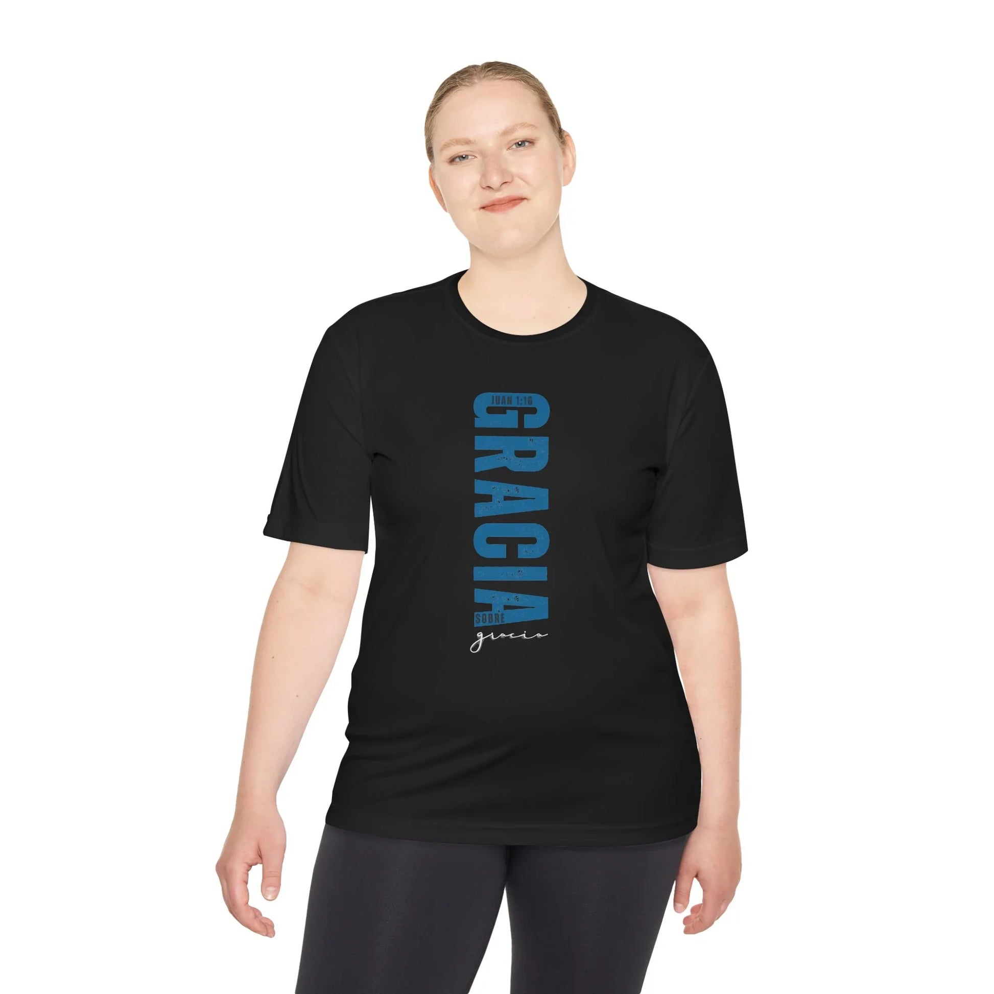 Woman wearing black Christian t-shirt with Spanish faith design and Bible verse, studio shot