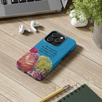 Blue Christian phone case with floral design and Psalm 37:23 Scripture on a desk