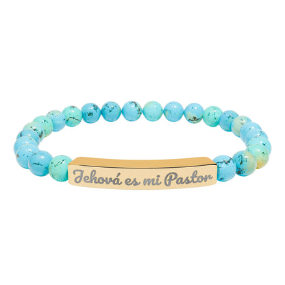 Blue beaded Christian bracelet with gold plate engraved 'Jehová es mi Pastor'