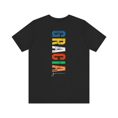 Black Christian t-shirt with colorful vertical 'Gracia sobre gracia' text and John 1:16 verse.