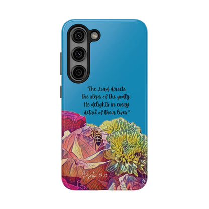Blue phone case with colorful flowers and Psalm 37:23 Bible verse inspirational quote.