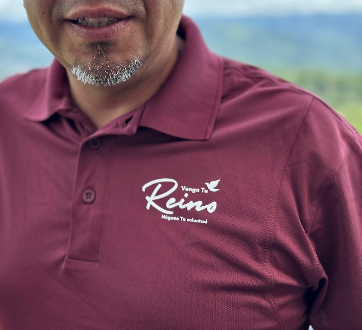 Man wearing burgundy Christian polo shirt with 'Venga Tu Reino' text and dove graphic