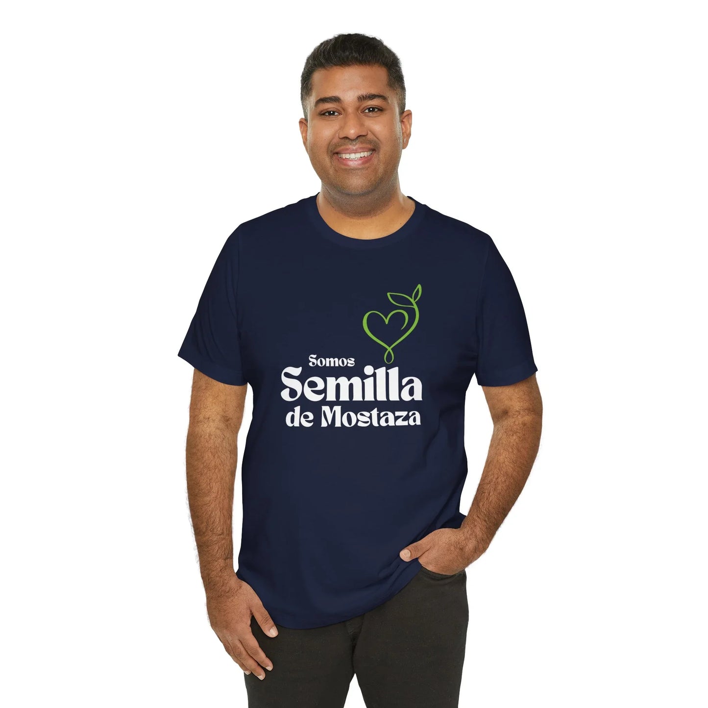 Man wearing navy Christian t-shirt with 'Somos Semilla de Mostaza' and heart plant graphic