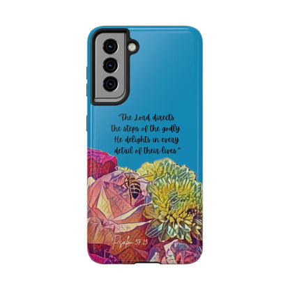 Christian phone case with colorful floral design and Psalm 37:23 Scripture in English.