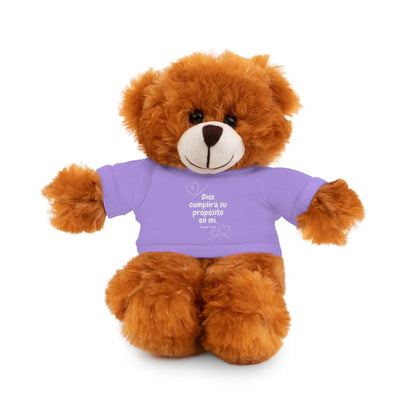 Plush brown teddy bear wearing a purple shirt with Spanish faith message and heart accents.