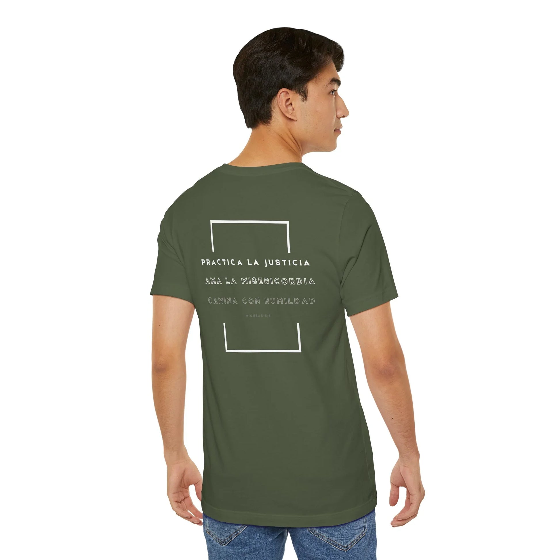 Man wearing olive green Christian t-shirt with Spanish Bible verse text on back