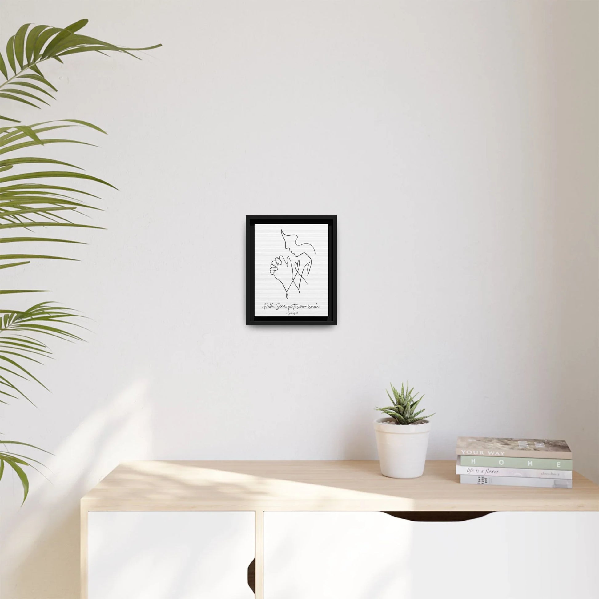 Minimalist Christian wall art with praying hands and dove, framed on modern home décor wall