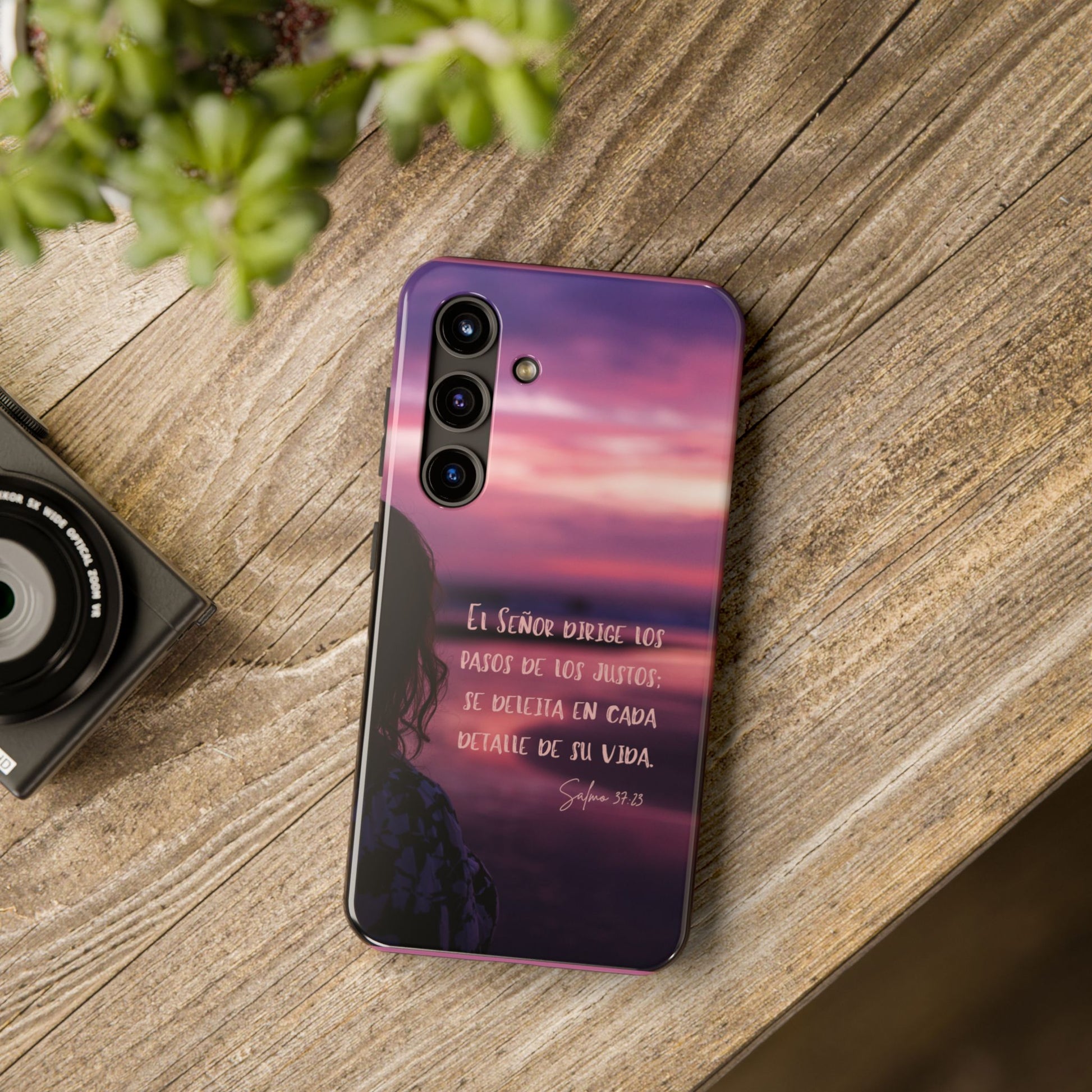 Christian phone case with Spanish Scripture design on rustic wood table