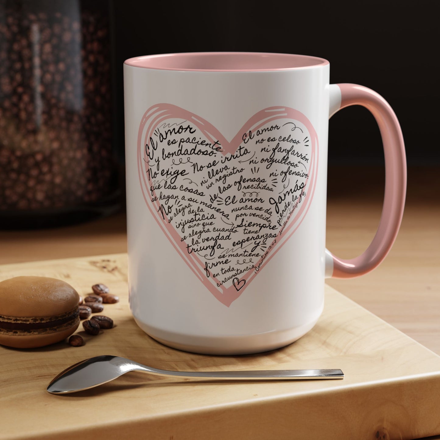 White ceramic mug with pink heart, Spanish Bible verse text, pink handle, on wooden tray