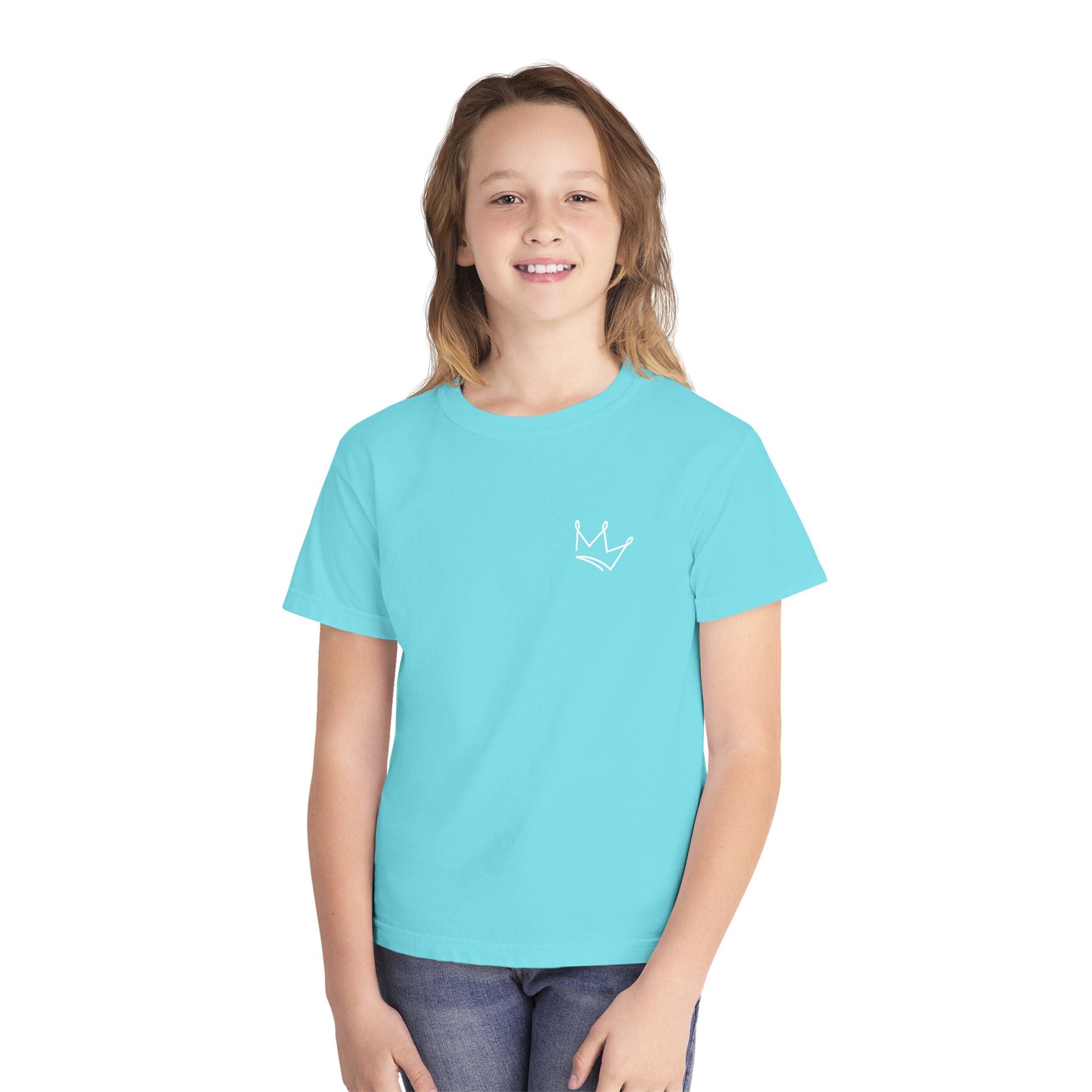 Smiling child in light blue Christian t-shirt with simple white crown graphic