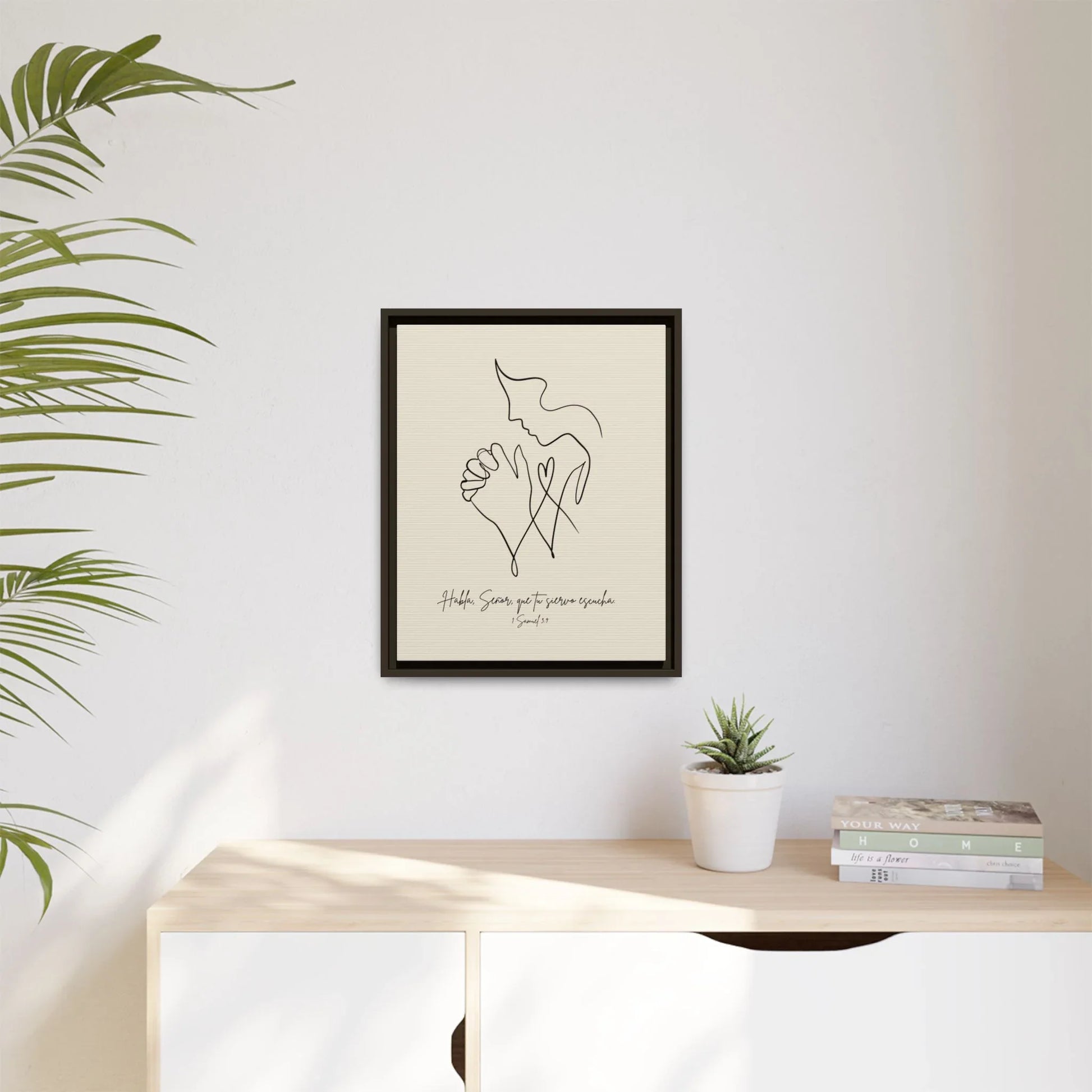 Minimalist Christian wall art with praying hands above a modern sideboard, home décor