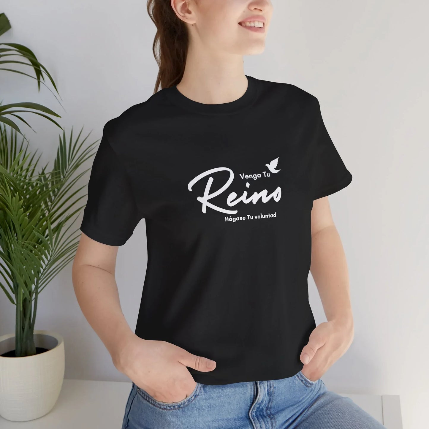 Woman wearing black Christian t-shirt with Spanish faith message Venga Tu Reino
