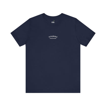 Navy blue Christian t-shirt with Spanish faith message 'De Su plenitud tomamos todos' on front.