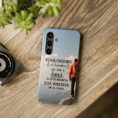 Christian phone case with Psalm 112:1-2 in Spanish, outdoors hiking design, on wooden table