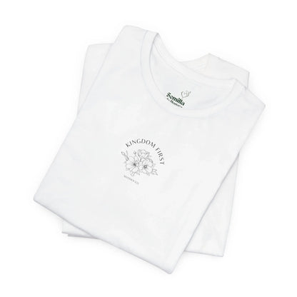 White Christian t-shirt with 'Kingdom First' floral Matthew 6:33 design, folded flat