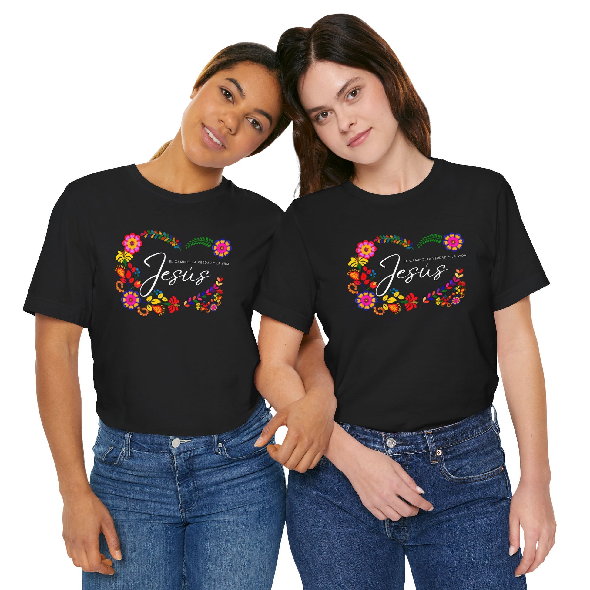 Two women wearing matching black Christian t-shirts with floral Jesus designs