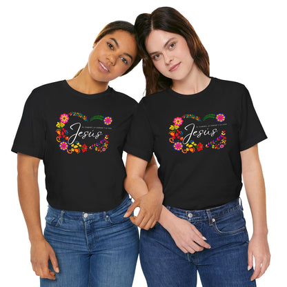 Two women wearing matching black Christian t-shirts with floral Jesus designs