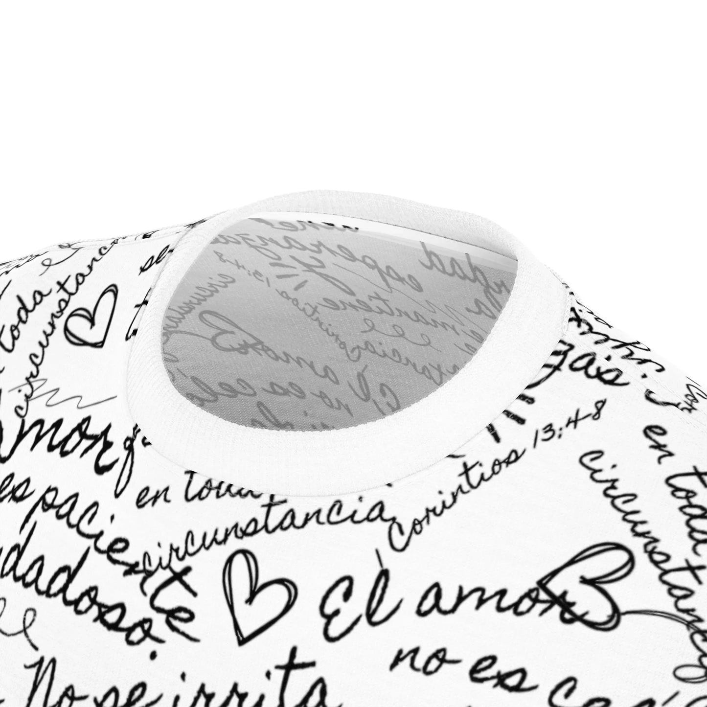 Close-up of Christian t-shirt with Spanish handwritten Scripture and heart designs