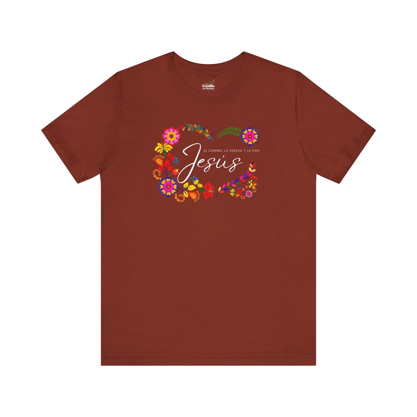 Brown T-shirt with colorful floral design and Spanish Christian text about Jesus.