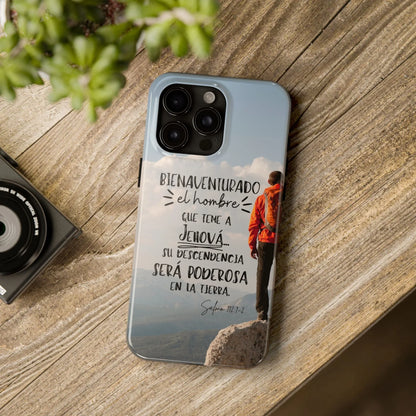 Christian phone case with Spanish Bible verse, hiker on mountain, wooden table background