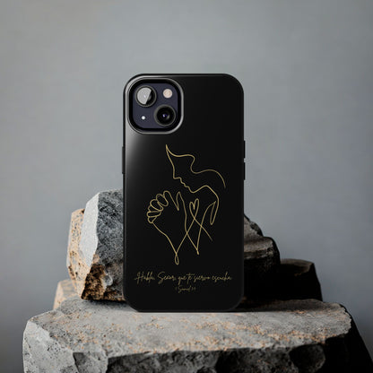 Black Christian phone case with gold praying figure design and Spanish Bible verse, on stone.