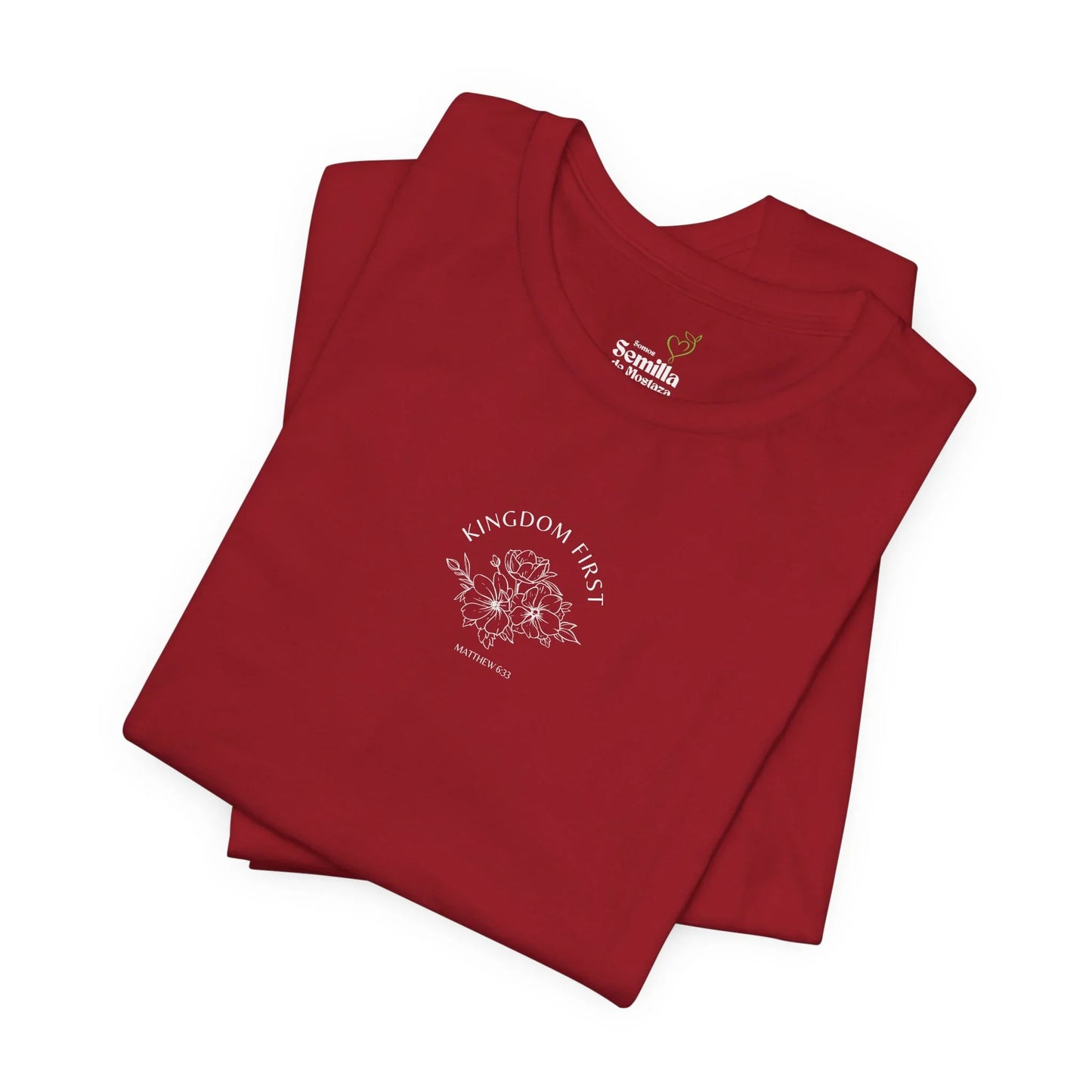Red Christian t-shirt with 'Kingdom First Matthew 6:33' and floral graphic folded neatly